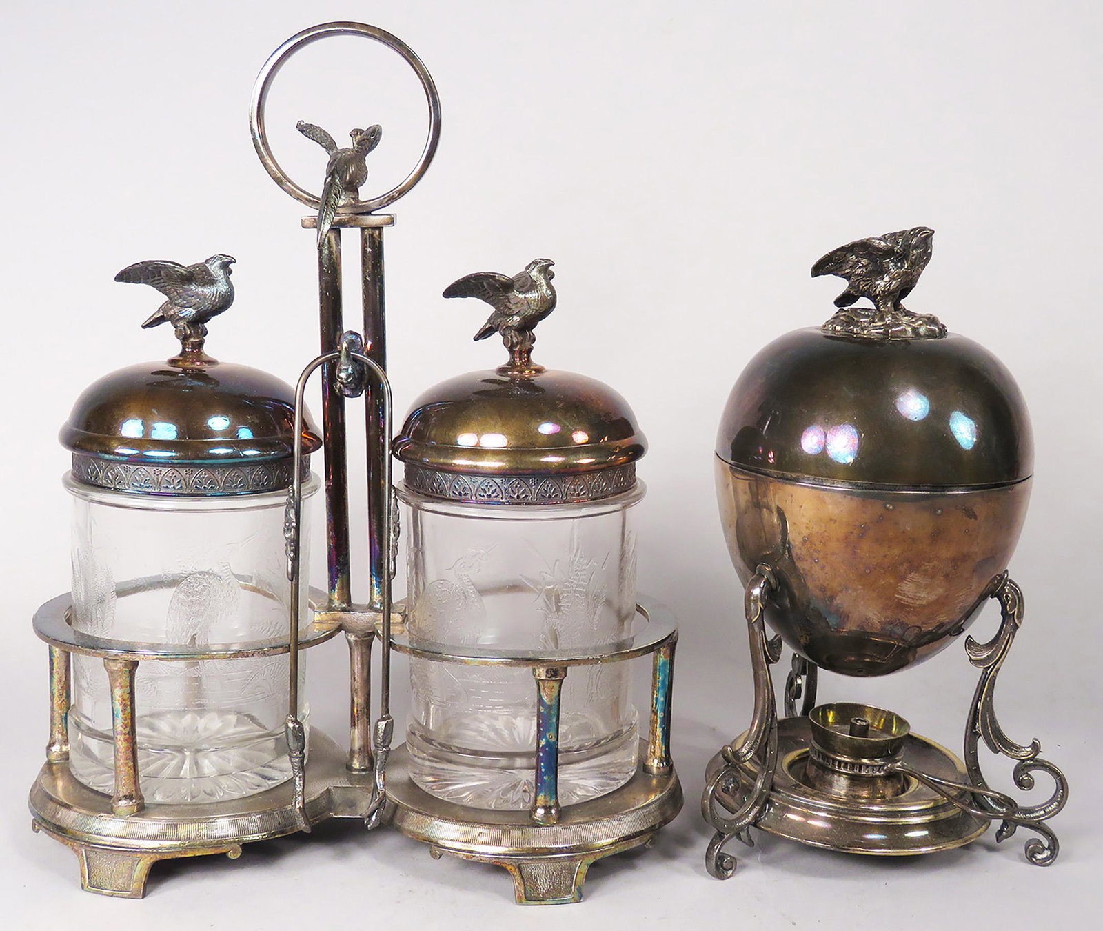 Victorian Silver Plate Egg Heater and Pickle Castor: Victorian Silver Plate, Egg Heater and Pickle Castor. Castor has embossed glass jar with Eagle finials. Heater has insert to hold eggs with Eagle finial. Castor set made by Roger Bros. Waterbury, Conn