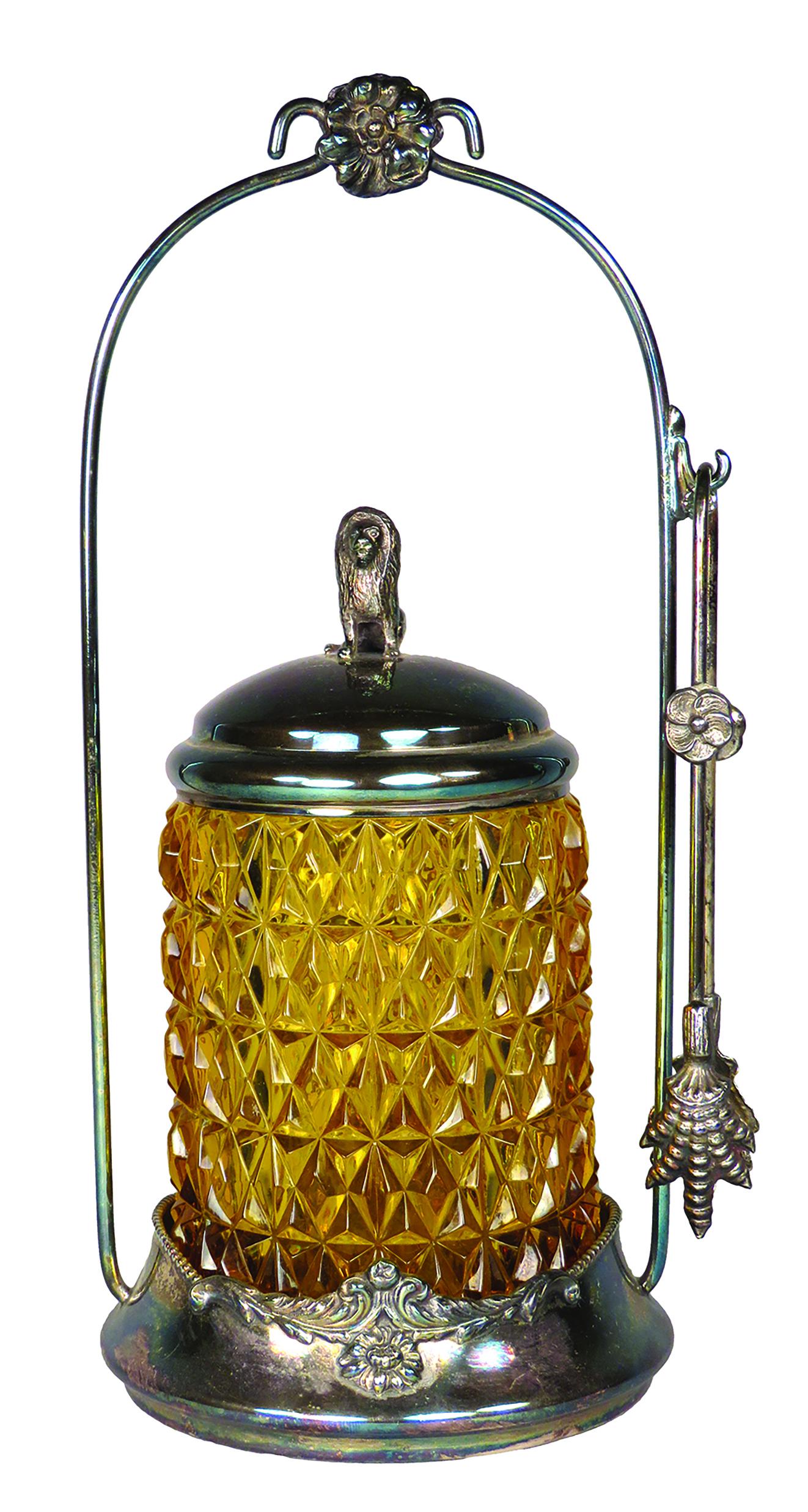 Pairpoint Mfg. Co. Victorian Pickle Caster: Pairpoint Mfg. Co.. Victorian Pickle Caster. Silver plate with lion finial. Diamond pattern amber glass. No chips or cracks. 10 1/4 inches tall.