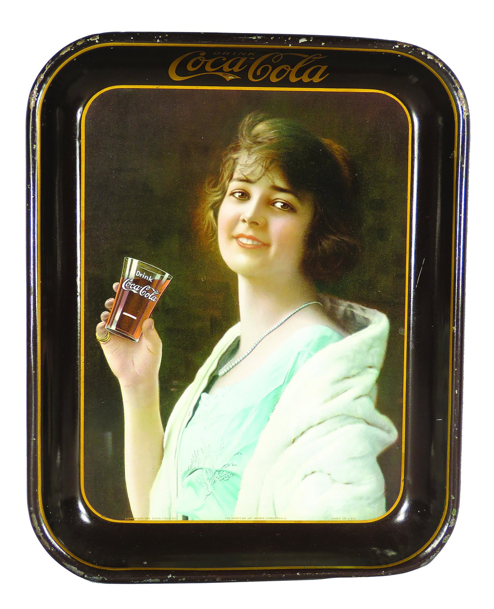 1924 Original Coca Cola Tin Serving Tray: 1924 Original, Coca Cola Tin Serving Tray, brown rim version. Girl in blue dress with white fur wrap. Scratch on interior rim at 3:00 and edgewear otherwise very good condition. 10 1/2 X 13 1/4 inches