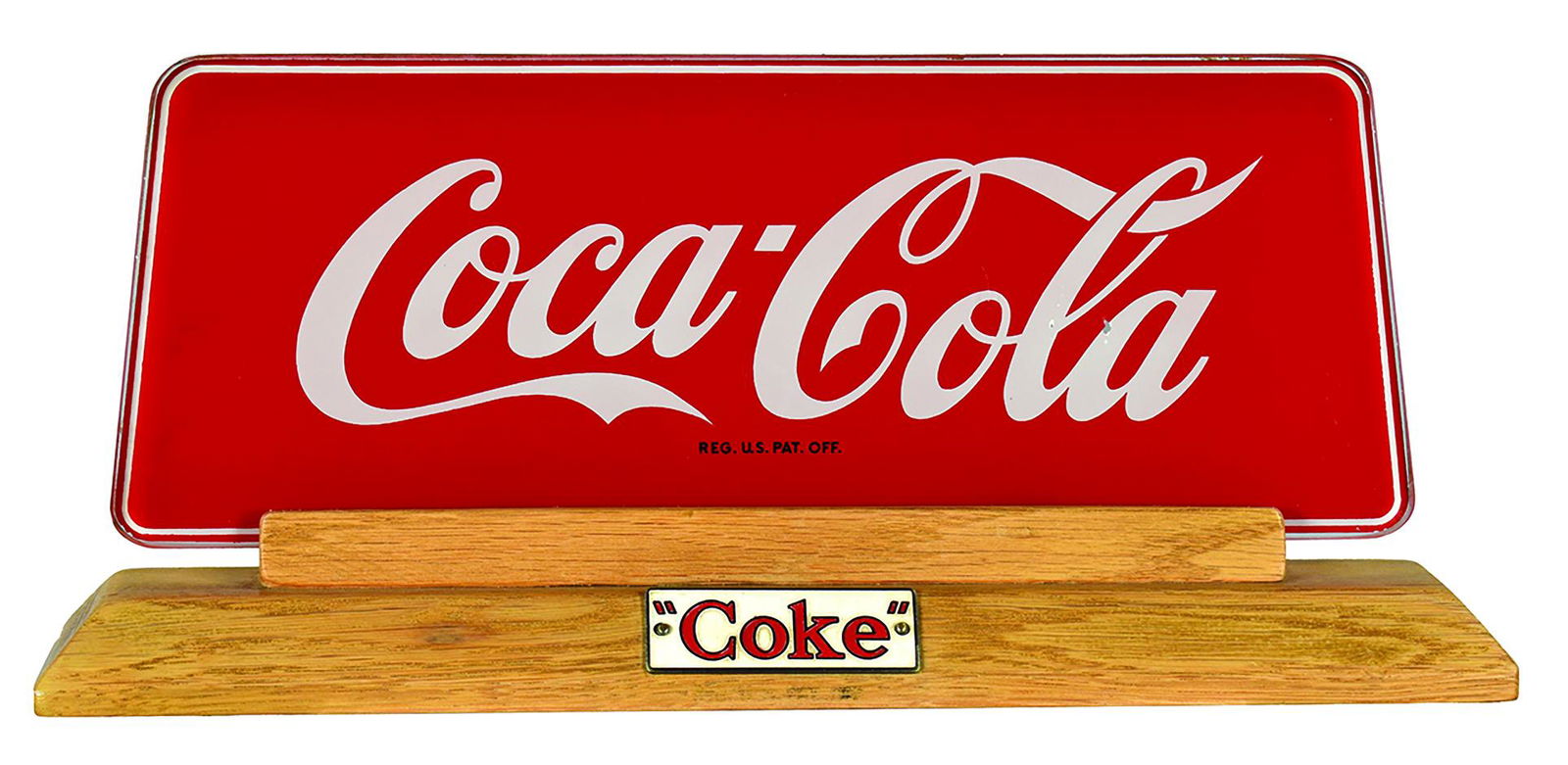 1950's Coca Cola Cash Register Topper: 1950's Coca Cola, Cash Register Topper. Glass on wood base with enameled "Coke" badge on wood. Price Brothers Inc. New York. Small paint chip on "a" otherwise excellent condition. 11 1/2 X 5 inches.