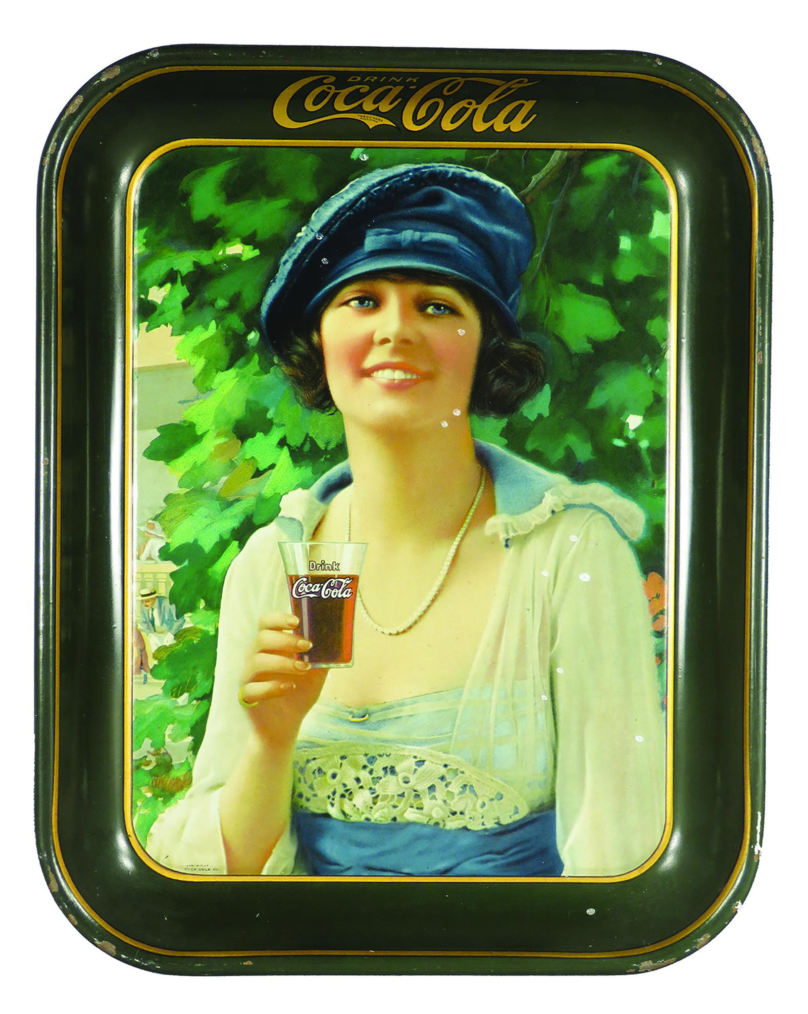 1921 Original Coca Cola Tin Serving Tray: 1921 Original, Coca Cola Tin Serving Tray. Girl in blue hat and dress. Specks of paint and edgewear otherwise good condition. 10 1/2 X 13 1/4 inches.