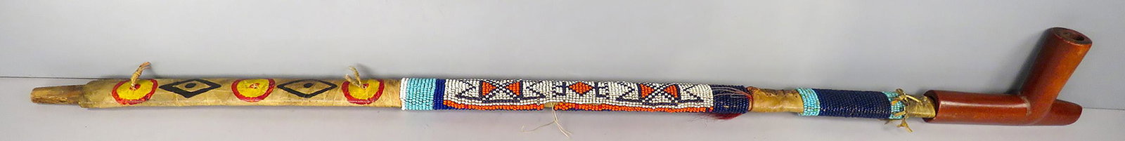 Native American Indian Ceremonial Peace Pipe: Native American Indian Ceremonial Peace Pipe with Pipestone Elbow. Beaded Stem with Leather Decoration. Very Good Condition. Approx. 28 inches long.