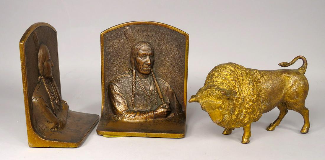 Bronze Native American Motif Bookends: Bronze Native American Motif Bookends by Gregory Allen. White metal gold washed buffalo statue. Bookends marked Bronze 9693, 4 1/2 X 5 1/2 X 2 1/4 inches each. Buffalo 6 1/2 inches wide.