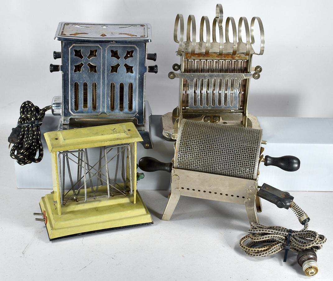 Collection of 4 Vintage Toasters: Collection of 4 Vintage Toasters and Popper. From left to right, back to front. Marked as follows: Girard, early 1900's, olive green steel. The Cracker Jack Co. "Pop-It" mini popper with electrical pl