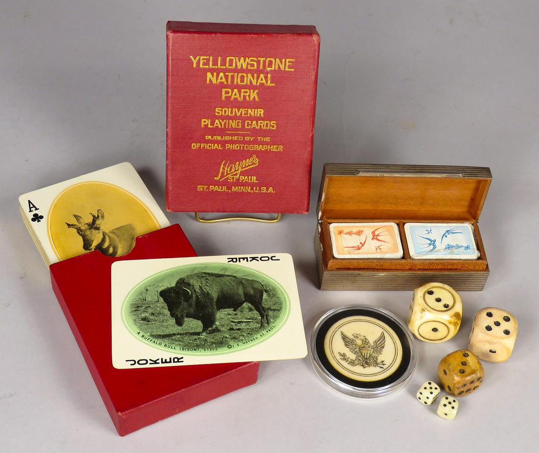 Collection of Antique Gambling Items: Collection of Antique Gambling Items. (5) dice, Eagle poker chip, Sterling Silver miniature playing card box and Yellowstone National Park Souvenir Playing Cards (complete).