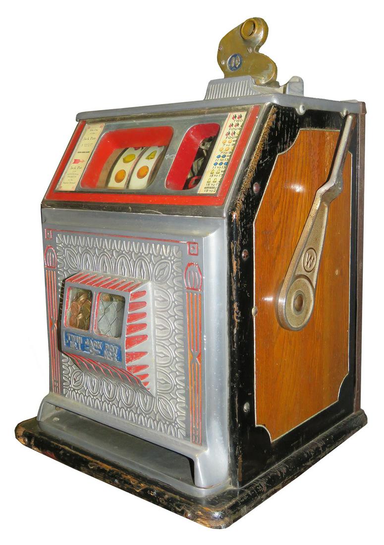 1 Cent Watling Wonder Bell Slot Machine: Coin Operated, 1 Cent Watling Wonder Bell 3 Reel Slot Machine, 1934. Red and blue, excellent original working condition, comes with key.