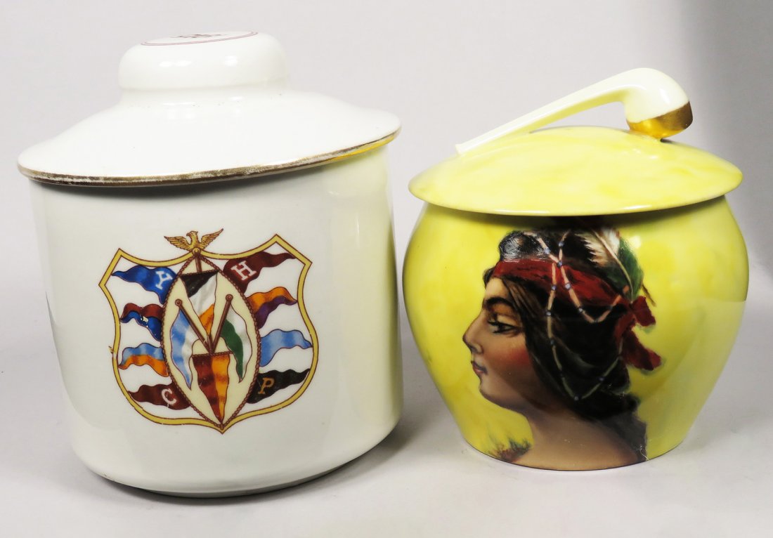 Two Antique Porcelain Humidors: Two Antique Porcelain Humidors. Small yellow with Indian Maiden, by artist G. Fritz, marked T & V Limoges, France, no chips or cracks, 6 inches tall X 5 1/4 inch diameter. CYHP flags and crest, 1915, 