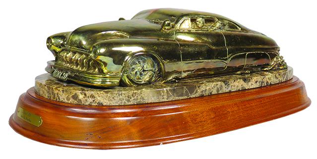 "Cool 50" Stanley Wanlass Automotive Bronze: "Cool 50" Stanley Wanlass, Automotive Bronze, 1986. Brass plated on onyx and wood base. 22 X 7 X 11 inches overall.