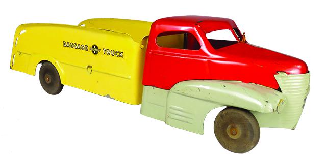Buddy L Pressed Steel Toy Baggage Truck: Buddy L Pressed Steel, Toy Baggage Truck, ca. 1945-48. Model 401, type II. Red, grey and yellow. Purchased at the Buddy L morgue sale. Original condition with light scratches. 17 inches long.