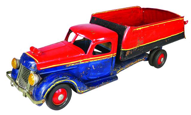 Buddy L Pressed Steel Toy Rider Dump Truck: Buddy L Pressed Steel, Toy Rider Dump Truck, ca. 1947-48. Model 702. Blue and red. Repainted condition, missing handle and seat. Scratches and paint loss. 22 inches long.