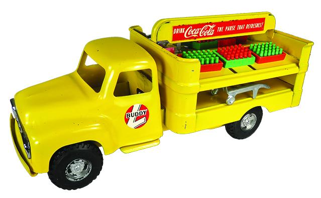 Buddy L Pressed Steel Toy Coca Cola Delivery Truck: Buddy L Pressed Steel, Toy Coca Cola Delivery Truck, ca. 1957. Model 5546, yellow. Original condition with accessories. A few very minor rubs. 14 3/4 inches long.