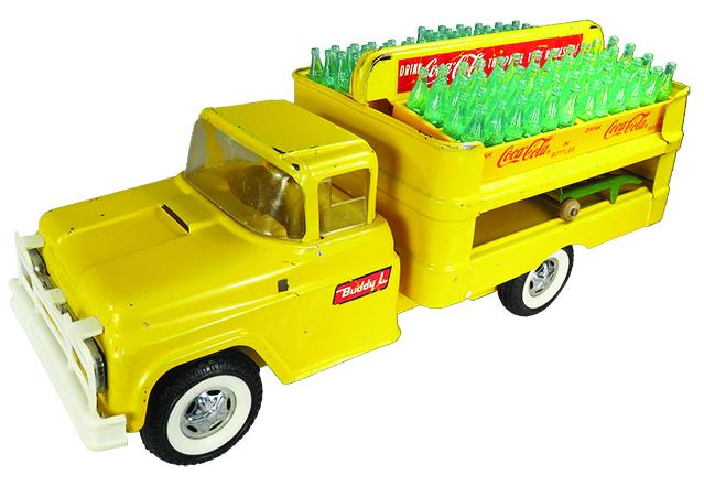 Buddy L Pressed Steel Toy Coca Cola Delivery Truck: Buddy L Pressed Steel, Toy Coca Cola Delivery Truck, ca. 1961. Model 5426, yellow. Original condition with accessories. Light scratches. 15 inches long.