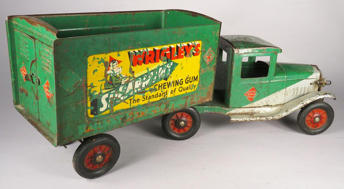 Buddy L Pressed Steel Toy Railway Express Truck: Buddy L Pressed Steel, Toy Railway Express Truck, Wrigley's, ca. 1935. International tractor trailer with electric lights and unusual two-tone silver and green paint. Original condition, no roof on tr