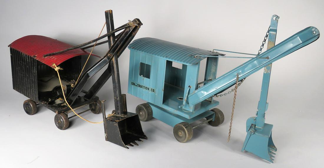 Two Vintage Pressed Steel Toy Steam Shovels: Two Vintage Pressed Steel Toy Steam Shovels. Structo Toys, blue, very good condition, 16 X 11 1/2 X 6 inches. Black/red shovel with "Marion" on back, good condition, 14 1/2 X 11 X 5 1/2 inches.