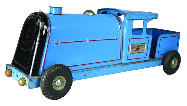 Tri-Ang Express, Lines Bros. Pressed Steel Locomotive: Pressed Steel Tri-Ang Express Locomotive, Blue. 1950's Lines Brothers Pull Along Train. Made in England. Red lines appear to have been added. Approx. 15 inches long.