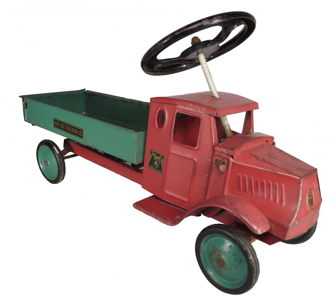 Steelcraft Pressed Steel Toy Mack Dump Truck: Steelcraft Pressed Steel, Toy Ride-On Mack Dump Truck. Play Boy. Ca. 1920's, red and green. Scratches and playwear, no seat. 25 inches long.