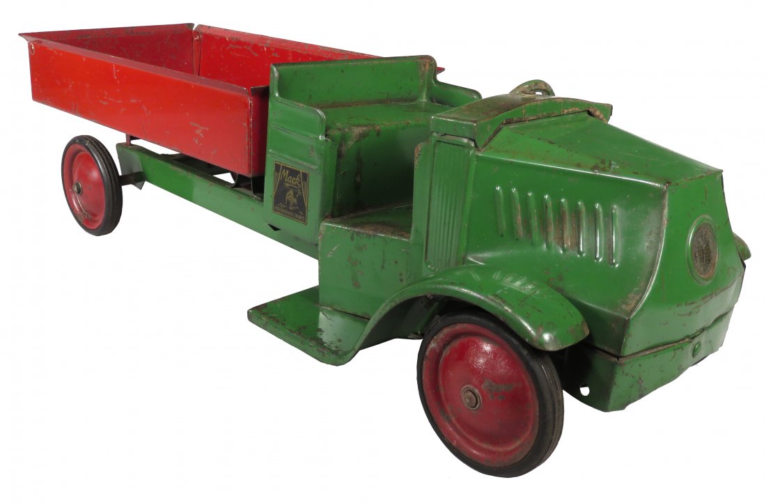 Steelcraft Pressed Steel Toy Mack Dump Truck: Steelcraft Pressed Steel, Toy Mack Dump Truck, ca. 1927. Red and green. Original condition with scratches and normal playwear. 22 inches long.