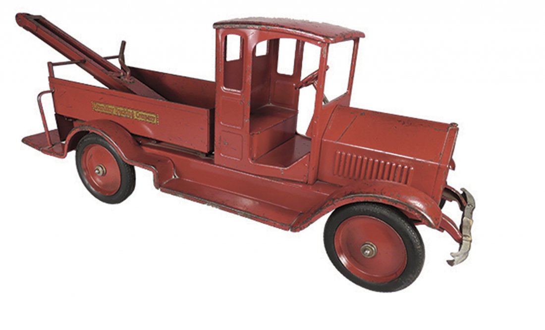 Sturditoy Pressed Steel Toy Wrecker Truck: Sturditoy Pressed Steel, Toy Trucking Co. Wrecker Truck, ca. 1926. Model 21, red. Original condition with scratches and normal playwear. 30 inches long overall.
