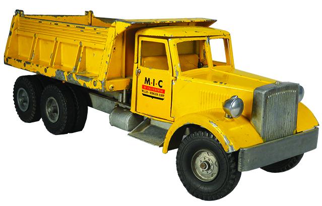 Smith Miller Pressed Steel Toy Hydraulic Dump Truck: Smith Miller Pressed Steel, Toy M.I.C. Hydraulic Dump L Mack Truck, ca. 1953. Model 533, yellow. Original condition with wear mostly around edges. 17 inches long.
