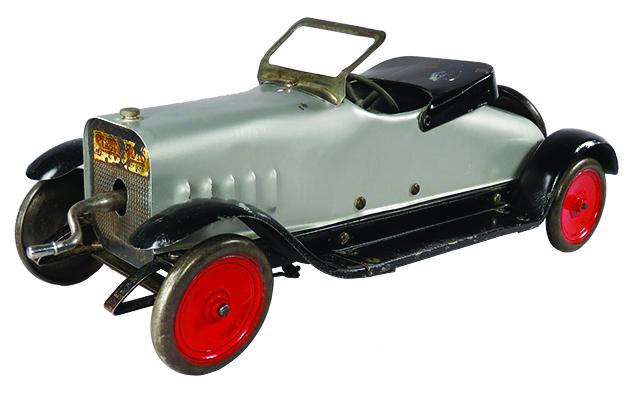 Structo Pressed Steel Toy Deluxe Racing Auto: Structo Pressed Steel, Toy Deluxe Auto-Auto Builder, ca. 1919. Silver. Model 12, sliding gear transmission, crank wind up. Repainted good condition. 15 1/2 inches long.