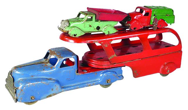 Vintage Pressed Steel Toy Transport Vehicle: Vintage Pressed Steel, Toy Transport Vehicle, ca. 1930's.Red and blue, comes with two wind up toy cars red and green. Original condition, scratches and paint loss. 14 inches long.