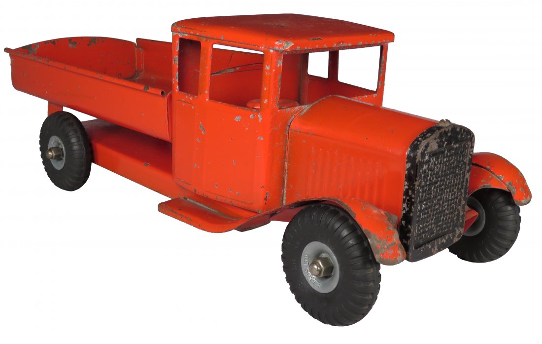 Tri-ang Toys Lines Bros. Ltd Steel Dump Truck: Tri-ang Toys Lines Bros. Ltd Pressed Steel Dump Truck. Ca. 1930's, red. Original condition with scratches and paint loss. 19 inches long.