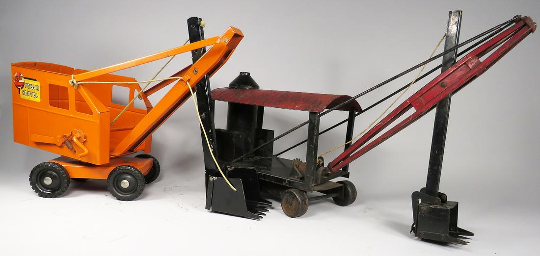 Two Vintage Pressed Steel Toy Steam Shovels: Two Vintage Pressed Steel Toy Steam Shovels. Buddy L, ca. 1935, Model 30, orange, restored condition, weld detached at top. 19 X 12 1/2 X 6 inches. Kelmet, ca. 1920's, red/black, good original conditi