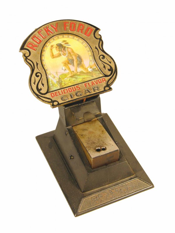 Rocky Ford Cigar Tip Cutter and match holder: Rocky Ford Cigar Tip Cutter and match holder. Good original condition. 6 X 8 1/2 X 10 1/2 inches.