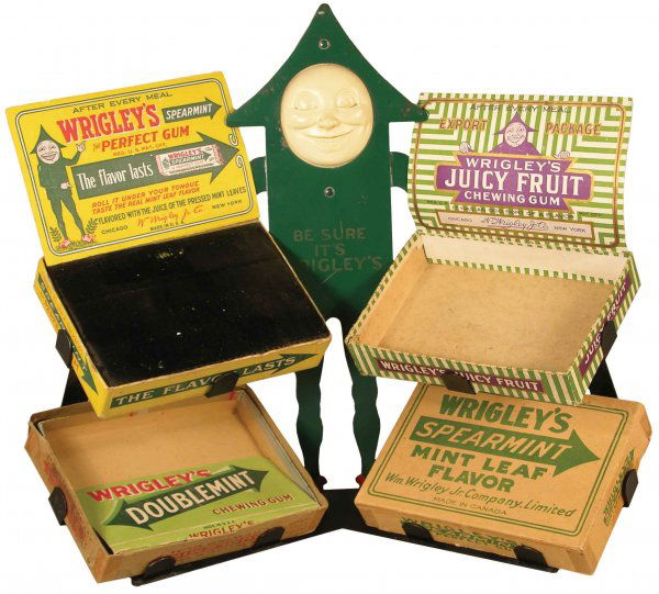 Wrigley's Gum Tin Store Display with celluloid f: Wrigley's Gum Tin Store Display with celluloid face. Comes with four different Wrigley's boxes. Very good original condition. 16 X 13 1/2 X 6 inches.