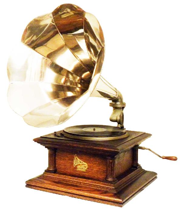 Columbia Graphophone: Columbia Graphophone. Ca 1906 with nickel horn. Table top model with original oak cabinet. Excellent original working condition. Horn measures 19 inch diameter.