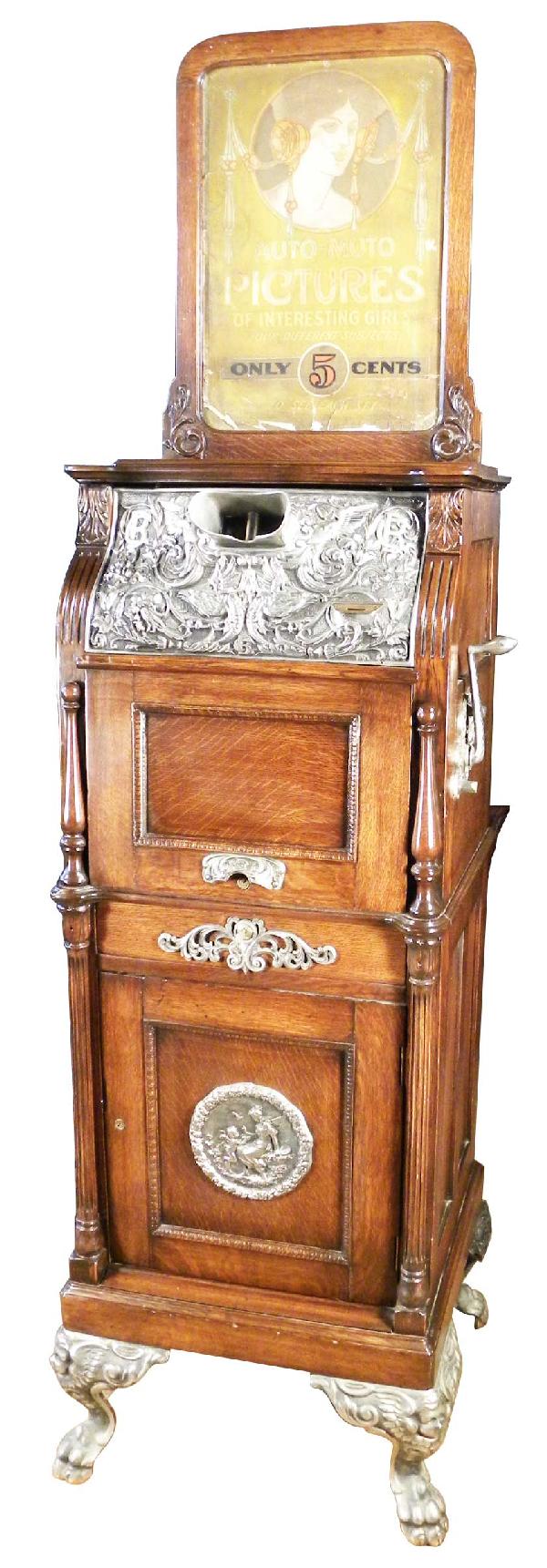 Peep Show by Caille Bros. Detroit.: Peep Show by Caille Bros. Detroit. High relief castings, original marquee. Full of risqué nude cards. Comes with key for cash door not for bottom. All original excellent condition. 21 X 56 X 19 inche