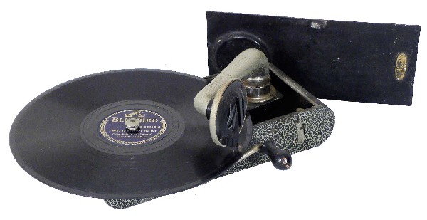 Small Portable Phonograph: Small Portable Phonograph. Ca. 1940's, Swiss made. Camera style metal case. Good original complete condition. 11 X 2 1/4 X 5 inches closed.