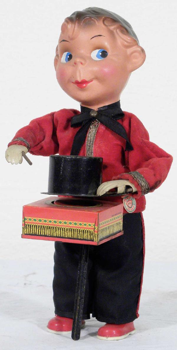 Magician tin Wind Up Toy: Magician tin Wind Up Toy. Made M-4-O Original, Germany. Excellent original working condition. 4 X 8 1/2 X 4 inches.