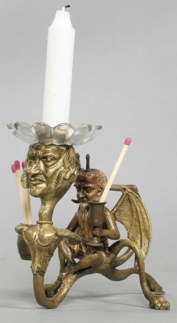 Bronze Devil Motif Match and Candle Holder: Bronze Devil Motif Match and Candle Holder for lighting cigars. Excellent condition. 6 1/2 X 4 1/4 X 4 inches.