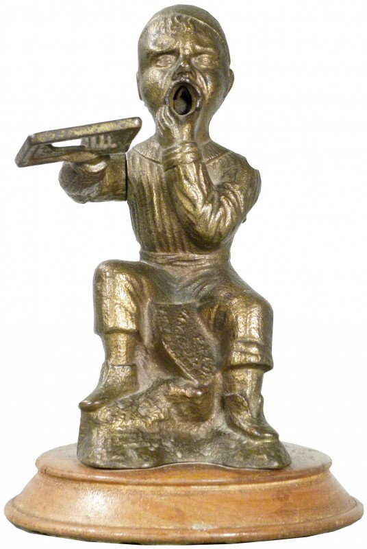 The Dunce Figural Cast Iron Cigar Tip Cutter: "The Dunce" Figural Cast Iron Cigar Tip Cutter. Patent 1888. Man in robe with hat. Excellent working condition. 7 inches tall.
