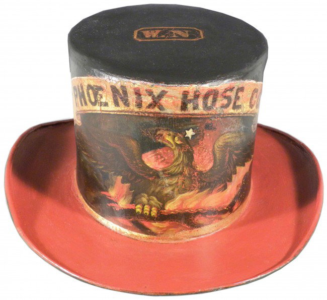 Firemen's Leather Parade Top Hat: Phoenix Hose Co. Early Firemen's Leather Parade Top Hat. Painted Phoenix and flames on front, "W.N." on top. Excellent condition. 12 X 13 3/4 X 5 5/8 inches.