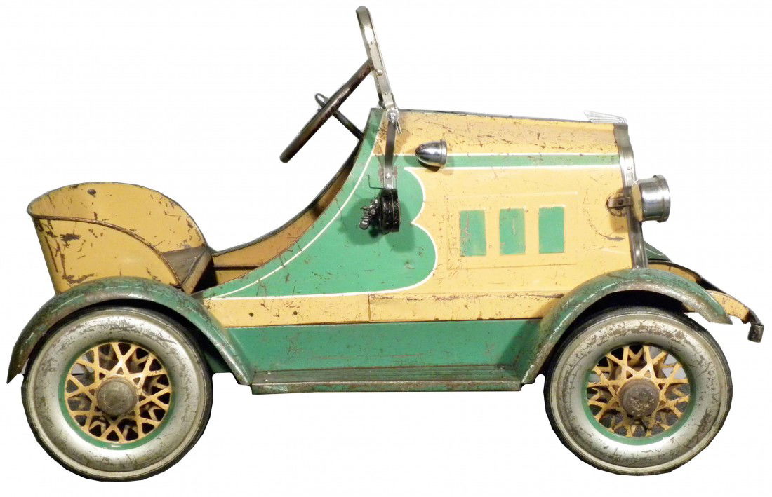 Toledo "Oakland" Pedal Car: Toledo "Oakland" Pedal Car. Ca. 1930's. Spotlight, horn, spoke wheel with metal frame. Missing isinglass otherwise excellent all original condition. 40 inches long.