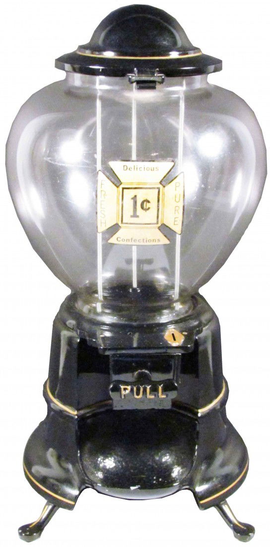 Hance One Cent Bulk Vendor: Hance One Cent Bulk Vendor. Black cast iron. Circa 1970's. Excellent all original working condition, comes with key. 18 1/2 inches tall.