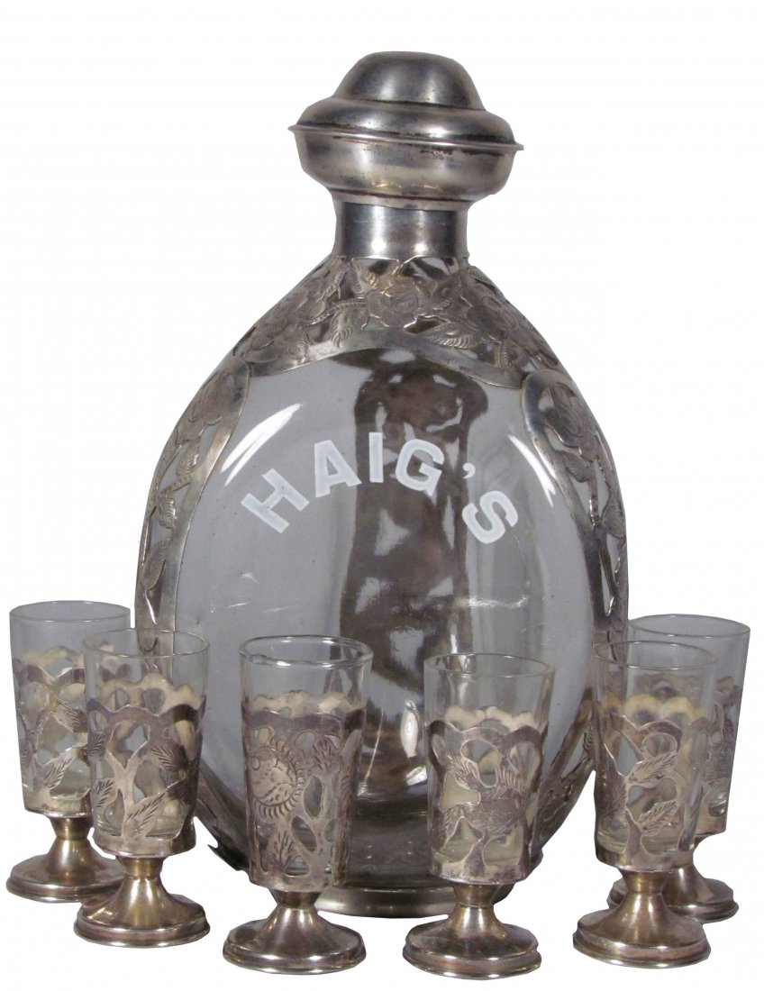 Haig's Silver Overlay Liquor Decanter: Haig's Silver Overlay Liquor Decanter with six matching shot glasses. No chips or cracks.
