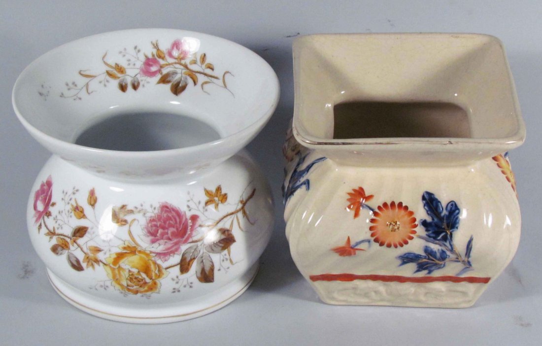 Two Ceramic Spittoons: Two Ceramic Spittoons. White with pink yellow floral. High glazed embossed with rust and blue flowers. No chips or cracks. Square on measures 5 3/4 X 5 3/4 inches.