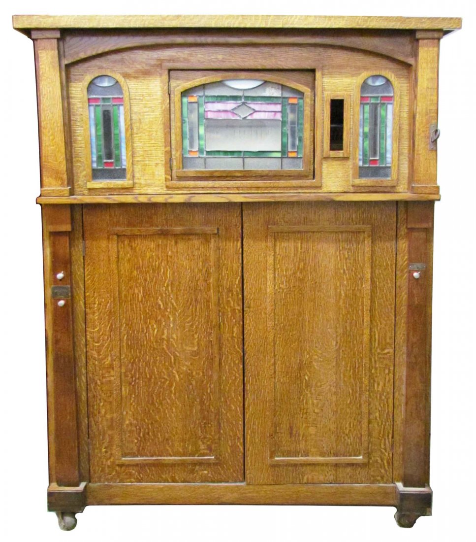 1920's Western Electric Piano Co. Nickelodeon: 1920's Western Electric Piano Co. Chicago Nickelodeon. Piano, mandolin and xylophone. Comes with 8 A rolls. Beautiful oak cabinet with leaded glass fronts. Good working condition. 47 1/4 X 63 X 23 1/2