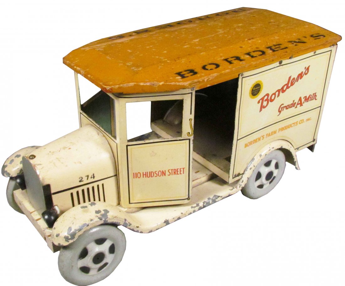 Borden's Farm Products Toy Milk Truck: Borden's Farm Products Toy Milk Truck. Marked 274, 110 Hudson St and Walker-Gordon Milk Products. Tin and wood construction. Some paint loss mostly to running boards and fenders otherwise very good co