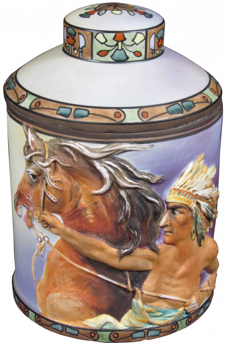 Nippon High Relief Porcelain Humidor: Hand Painted Nippon High Relief Porcelain Humidor. Depicting Native American and horse. Small chip bottom base otherwise excellent condition. 7 1/4 inches tall X 5 1/4 inch diameter.