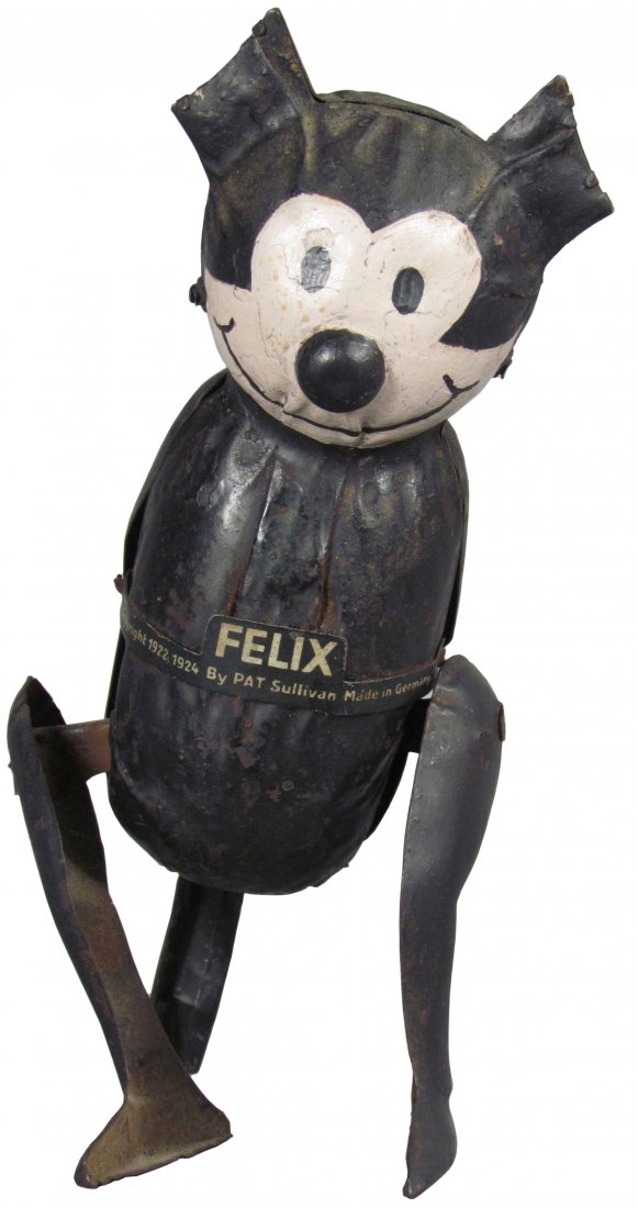 Felix the Cat German Tin Wind Up Toy: Felix the Cat German Tin Wind Up Toy. Some paint loss and wear, good condition. 7 1/4 inches tall.