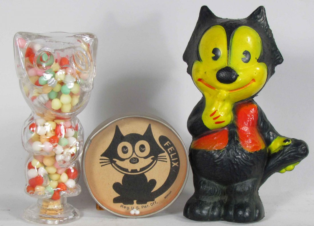 Lot of Miscellaneous Felix the Cat Items: Lot of Miscellaneous Felix the Cat Items including rubber squeaker toy, glass candy container and pocket skill game. Overall very good condition. Candy container measures 5 inches tall.