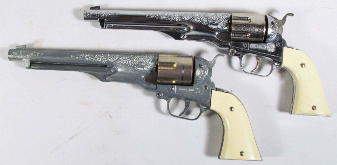Two Hubley Colt 45 Die Cast Toy Cap Guns: Two Hubley Colt 45 Die Cast Toy Cap Guns. 8 inch barrel. A few scratches on grips otherwise good condition.