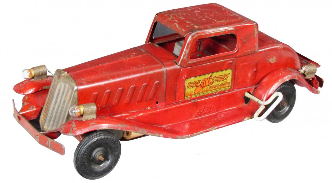 Pressed Steel Fire Chief Coupe Wind Up Toy: Pressed Steel Fire Chief Coupe Wind Up Toy. Girard Model Works, Girard, PA maker. Battery operated head and tail light. Original decal and paint. Tail light bulb missing and play wear otherwise good c