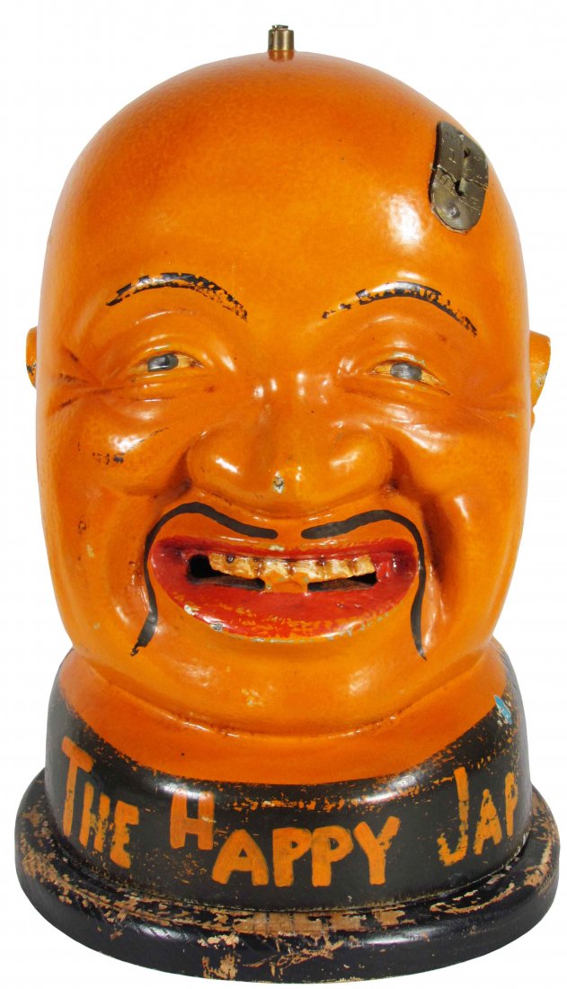 The Happy Jap Coin Operated Gum Vendor: The Happy Jap Coin Operated Gum Vendor without mechanism. Good Condition. 10 X 13 1/2 X 10 1/2 inches.