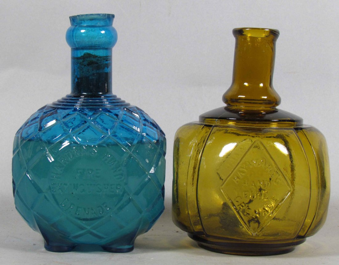 Lot of Two Glass Hand Fire Grenades: Lot of Two Glass Hand Fire Grenades. Hayward's amber diamond, patent 1871, no chips or cracks. Harden's blue footed, patent 1877, chips around lip.