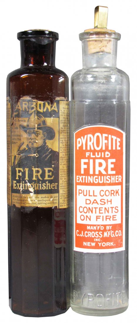 Lot of Two Glass Fire Extinguishers: Lot of Two Glass Fire Extinguishers. Carbona with original paper label, cork stopper. Pyrofite with original paper label, brass and cork stopper. No chips or cracks, paper loss to Carbona otherwise go